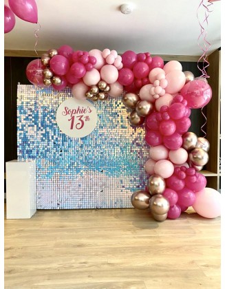 Holographic sequin backdrop with balloon arch